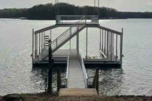 newly installed white wooden dock on lake